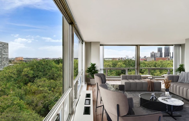 a living room with a large window and a view of the city
