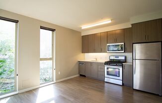 Modern & Sleek Top Floor 1 Bdr w/Dishwasher, W/D, and Condo Finishes!