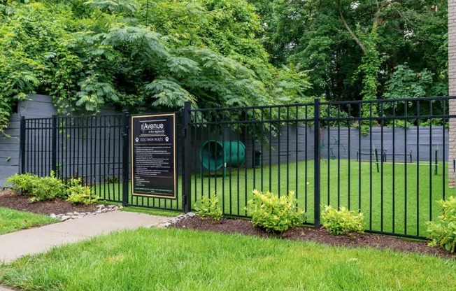 A black fence with a sign that says "Aquatic" on it.