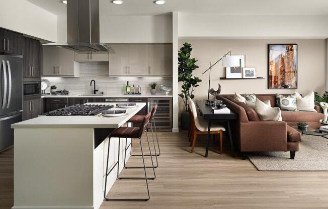 a kitchen and living room with a table and chairs