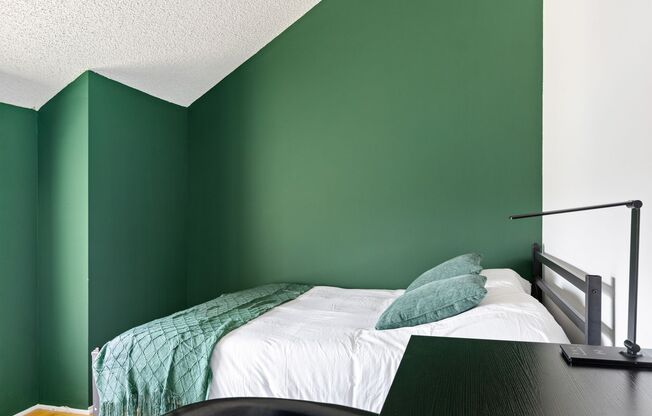 A fully furnished 4 bedroom, 2 bathroom apartment with common areas at 1823 Pelham Ave. Unit 5