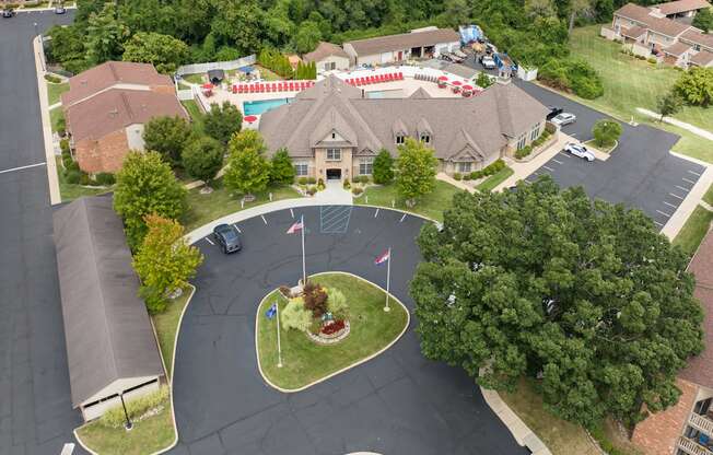 A large building with a flag on a pole in front of it.