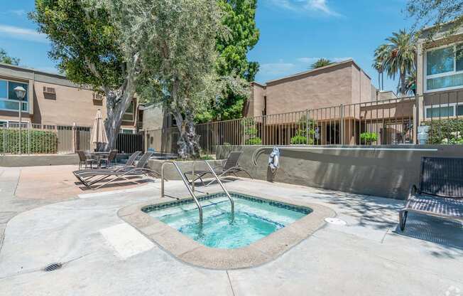 our apartments have a hot tub and lounge chairs in the pool