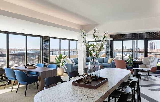 A lounge room with tables and chairs