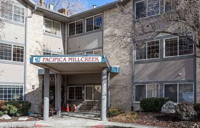 a building with a sign that reads in front of it