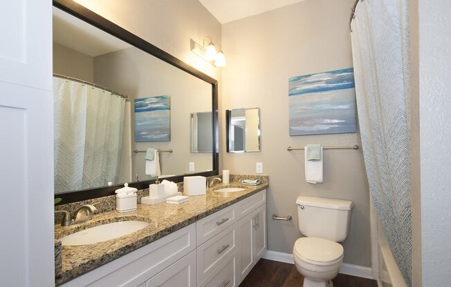 Dual vanities and framed mirrors in bathrooms