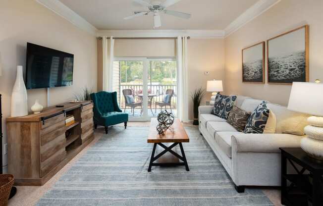 Living Room With Private Balcony at Abberly Pointe Apartment Homes by HHHunt, Beaufort, 29935