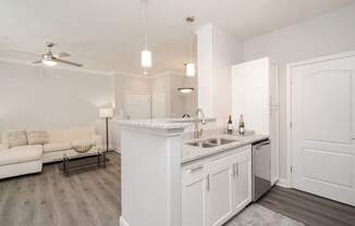 a kitchen and living room with a counter top