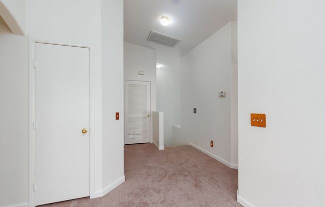Two bedroom townhome with garage in gated Henderson community.