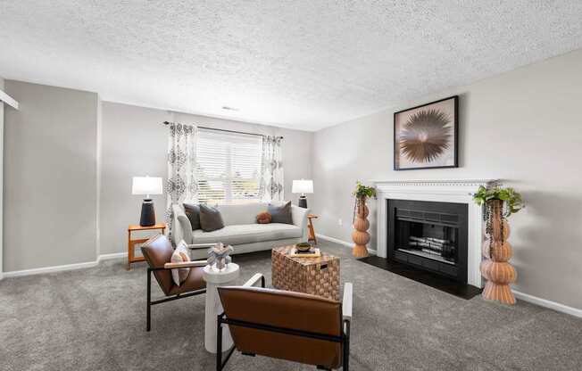 A living room with a fireplace and a couch.