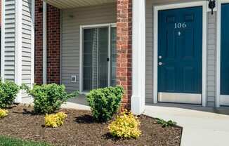 the front of a house with a blue door