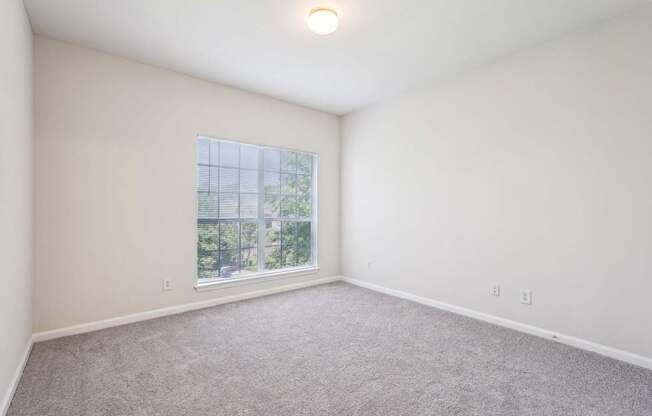 A big bedroom with a window
