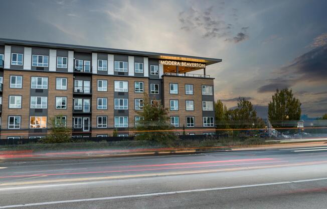 Evenings glow at Modera Beaverton, where contemporary architecture meets a prime location near dining, transit, and everyday essentials.