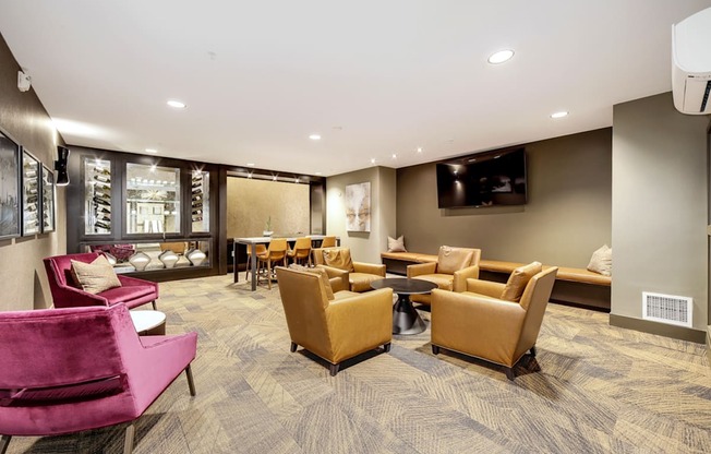 The Hayes on Stone Way Apartments  lounge area with chairs and tables and a television at The Hayes on Stone Way, Seattle, Washington