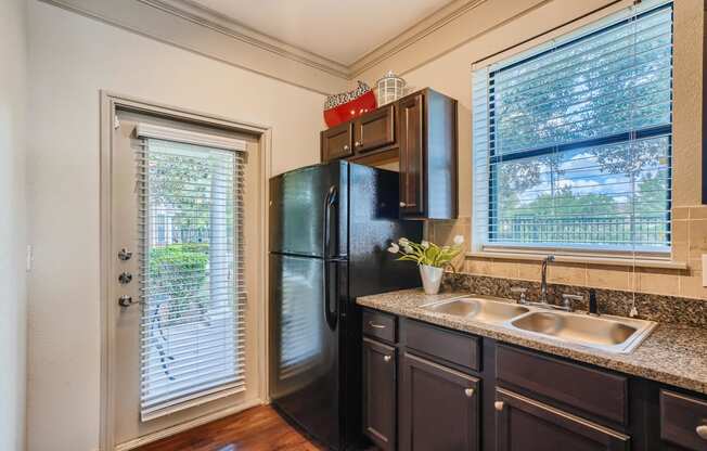 kitchen with patio door and sunny window