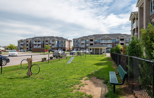 Dog park with a bench at Mosaic Apartments in Avon, Indiana