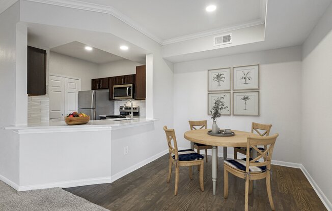 an open kitchen and dining area with a table and chairs at The Legends at Eagle Mountain Lake, Fort Worth, Texas