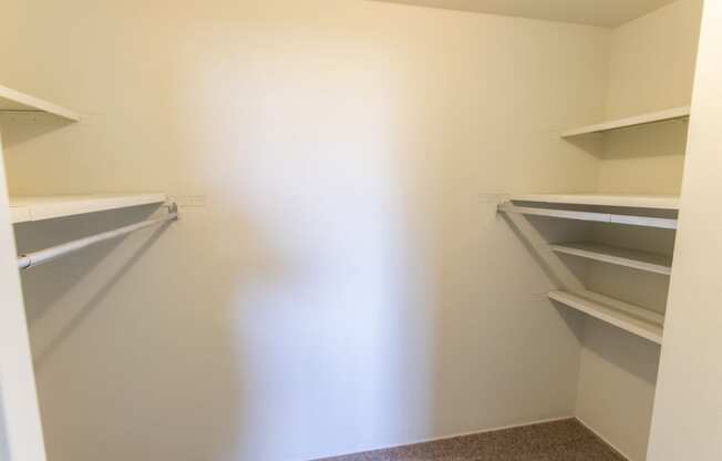 This is a photo of the bedroom walk-in closet in the 545 square foot 1 bedroom, 1 bath apartment at Lisa Ridge Apartments in the Westwood neighborhood of Cincinnati, Ohio.