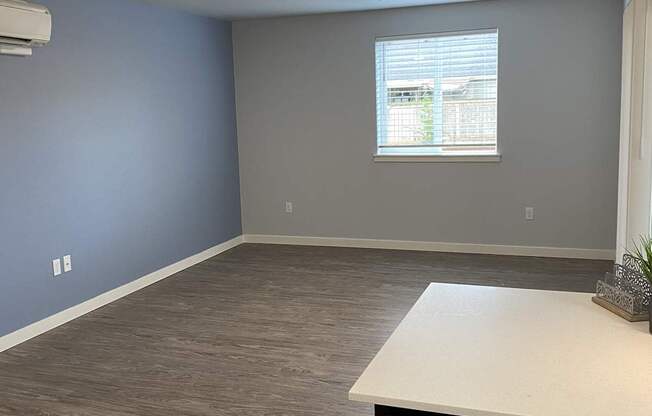 A room with a window and a counter.