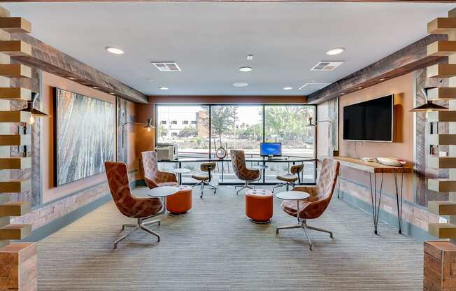 A modern living room with a television and comfortable seating.
