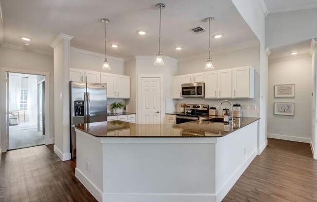 a kitchen with a counter top and a refrigerator
