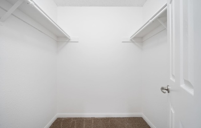 a walk in closet in a 555 waverly unit