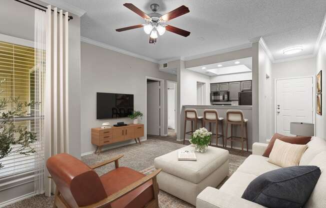 a living room with a ceiling fan