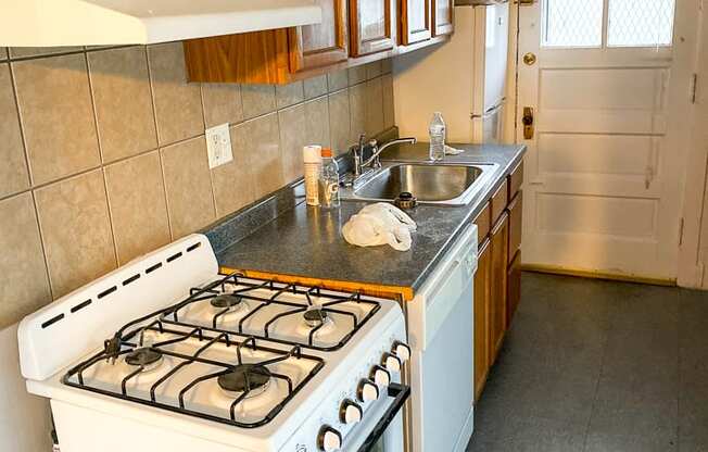 a kitchen with a stove and a sink