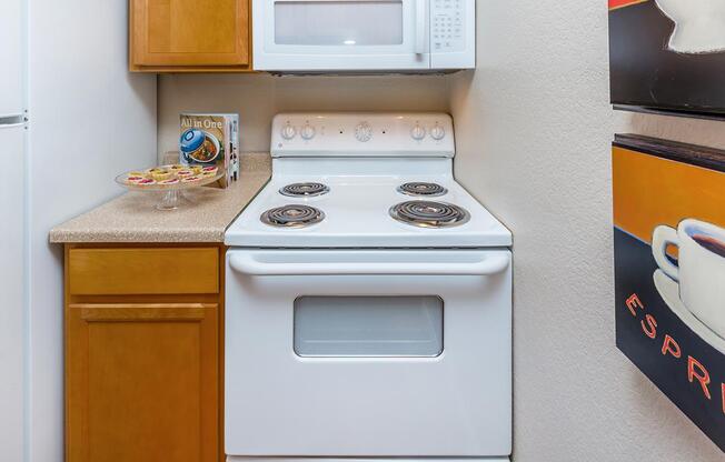 a stove top oven sitting inside of a kitchen