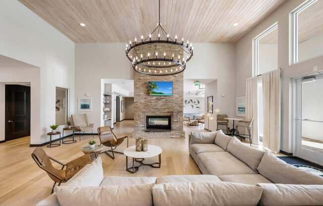 a living room with a large couch and a fireplace