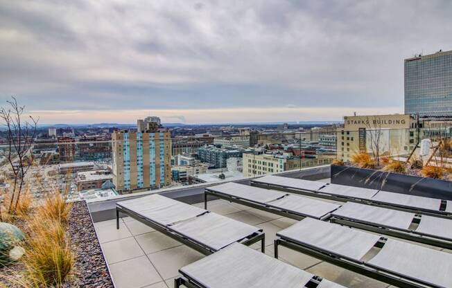A rooftop with a view of the cityscape.