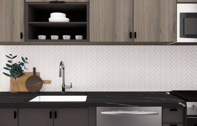 Each apartment kitchen features a single-basin sink with pull-down faucet and stylish tile backsplash.