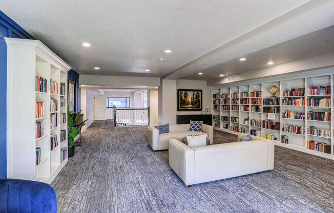 a large room with couches and bookshelves at The Beckstead, Utah, 84095