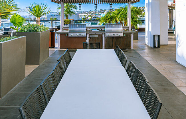 Community Outdoor Grill Area at AV8 Apartments in San Diego, CA