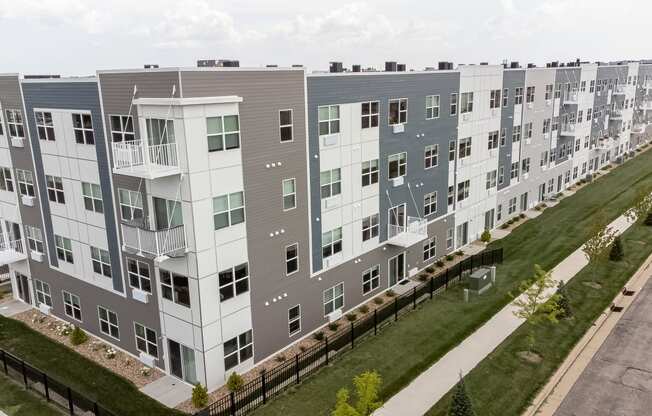 an aerial view of an apartment building on a city street