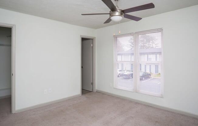 Bedroom with ceiling fan and light at Gardens at Camp Creek, Atlanta, GA,30349