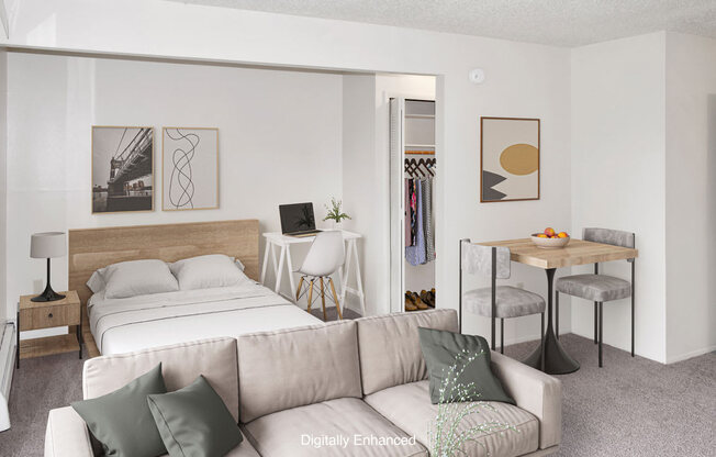 a living room with a sleeping area at Seville Apartments, Kalamazoo, 49009