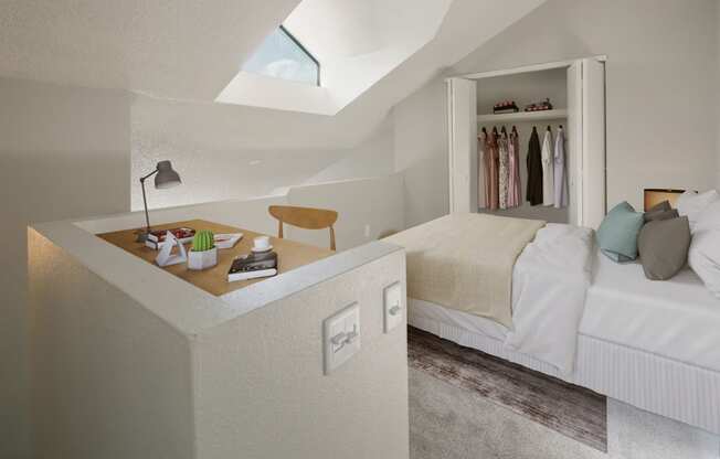 a bedroom with a bed and a counter with a desk