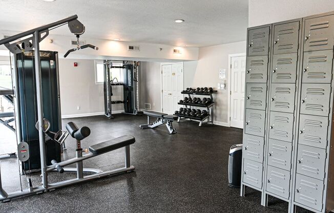 a home gym with weights and other exercise equipment