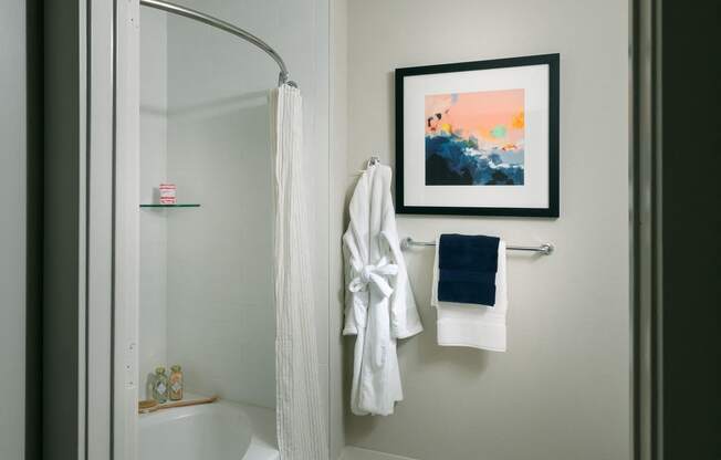 a bathroom with a shower and a toilet and a bath tub