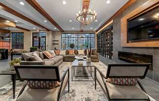 a living room with couches and a tv and a fireplace