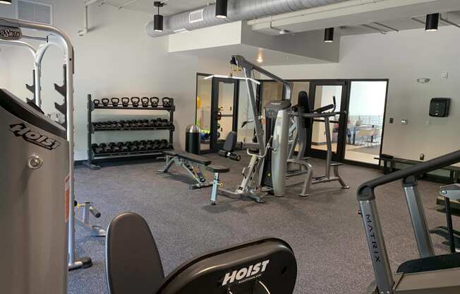 Fitness center with strength training and cardio equipment at Haven at Uptown