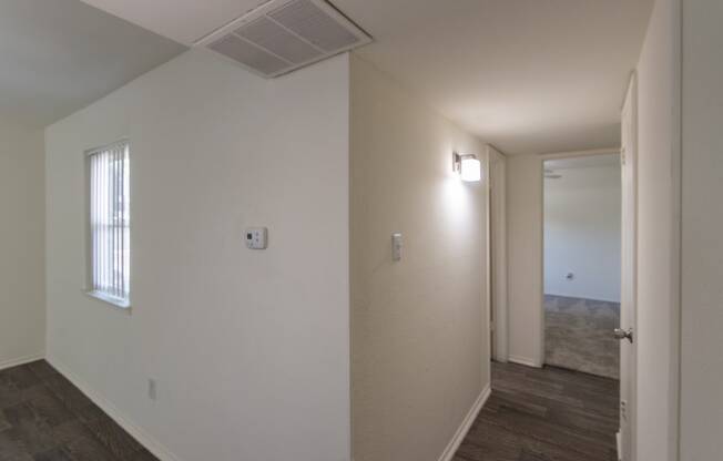 This is a photo of the hallway in the 970 square foot 2 bedroom, 2 bath apartment at Preston Park Apartments in Dallas, TX