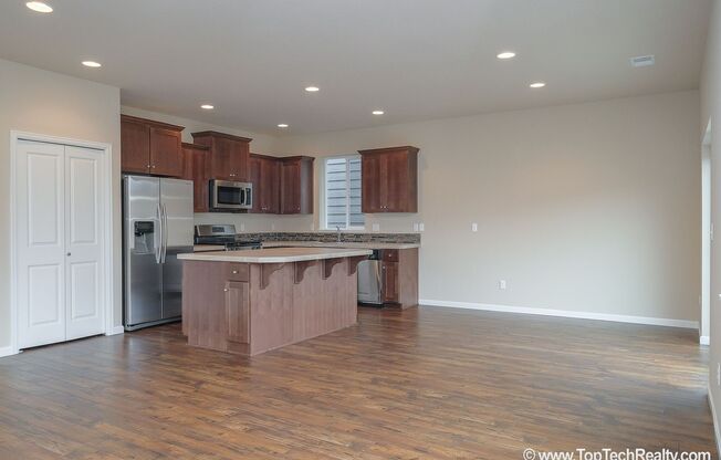 Spacious 4-Bedroom + Office Home in Abbey Creek – Modern Finishes, EV Charger & Low-Maintenance Backyard
