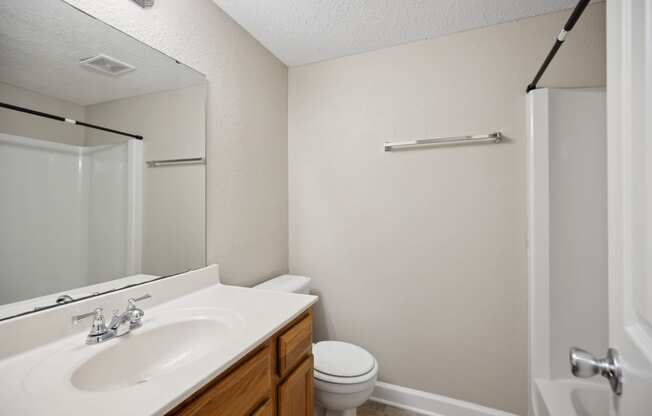 the preserve at ballantyne commons apartment bathroom with sink toilet and shower