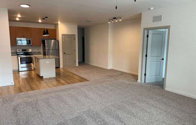 A spacious living area with carpet