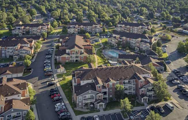 an aerial view of a neighborhood with houses and cars parked