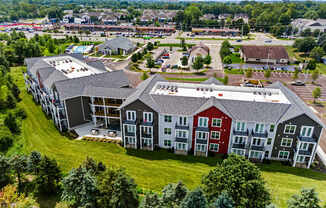 A large building complex with multiple buildings and a parking lot.