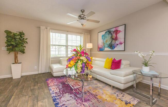 a living room filled with furniture and a rug