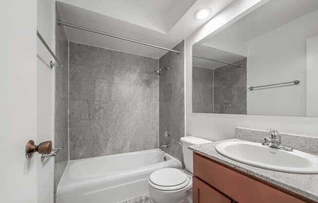 a bathroom with a sink toilet and bathtub